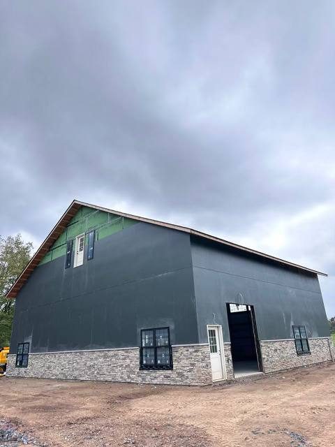 Progress — Custom Aircraft Hangar Exterior — Multi-System Cladding, Custom aircraft hangar